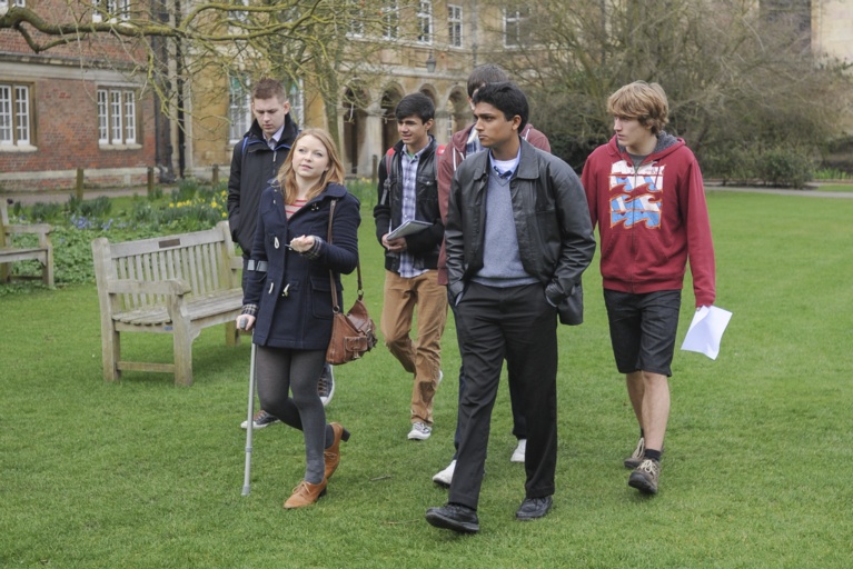 Students on a tour of College in the Paddock opposite Old Court