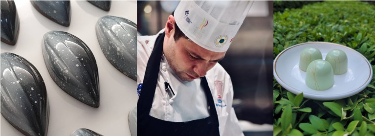 A group of grey-coloured chocolates, a chef working, three green chocolates balanced on a head of sage