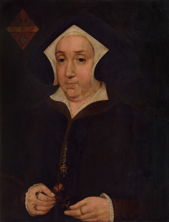 A portrait of a full-cheeked, middle-aged woman, wearing a black coat with red edging, and a rhombus-shaped head covering