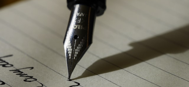 A fountain pen writing on paper